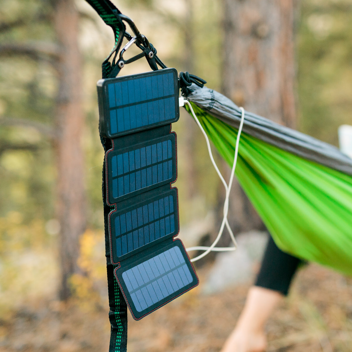 QuadraPro Solar Power Bank hanging open on a hammock
