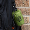 Green bivy clipped on backpack with carbiner