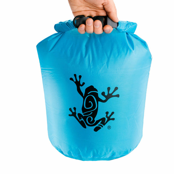 Hand carrying the dry bag by its rolled-up top