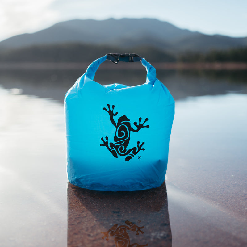 HydroStop 20L dry bag standing on a lake shore