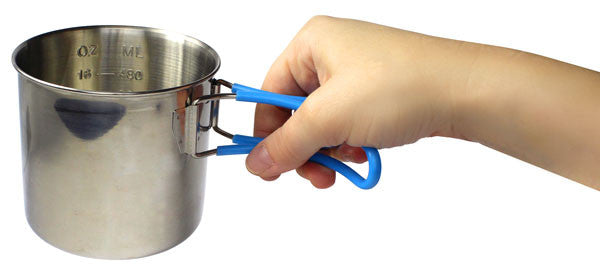 Camping cup side view with hand holding handles