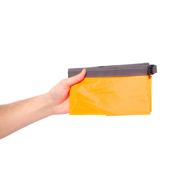Orange Lightweight Dry Bag Folded in Hand