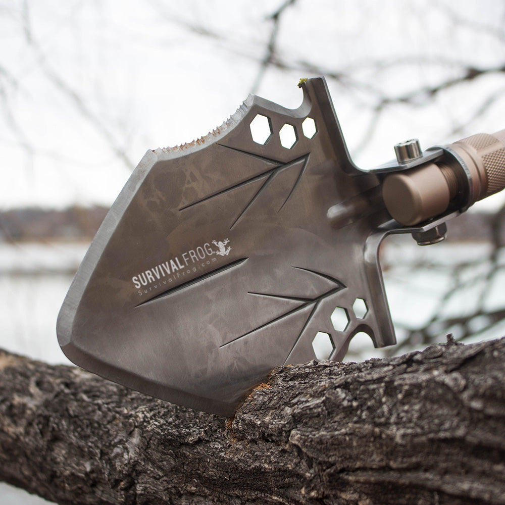 Tactical Shovel being used as a saw on tree