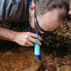 Drink from river with Survival Filter Straw