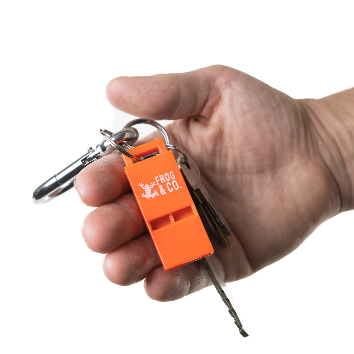Orange Scream Whistle hooked in key chain in hand with white background